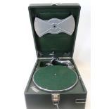 Vintage cased gramophone with carry handle, with green leatherette surface and interior