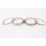 Four silver bangles