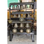 Impressive group of heavy horse bells mounted on a display stand
