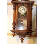 Vienna regulator-style wall clock in walnut case