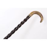 Late 19th century heavy walking stick with twisted ebonised shaft inset with ivory washer and horn