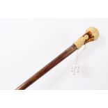 Early 20th century Hickory walking stick with moulded earthenware in the form of a classical child