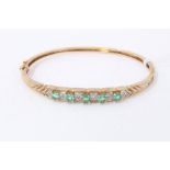 Gold 9ct emerald and diamond set bangle