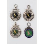 Group of four enamelled silver canary fancier’s medals