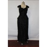 1950's black evening gown with gathered, boned and net lined bodice and full skirt.