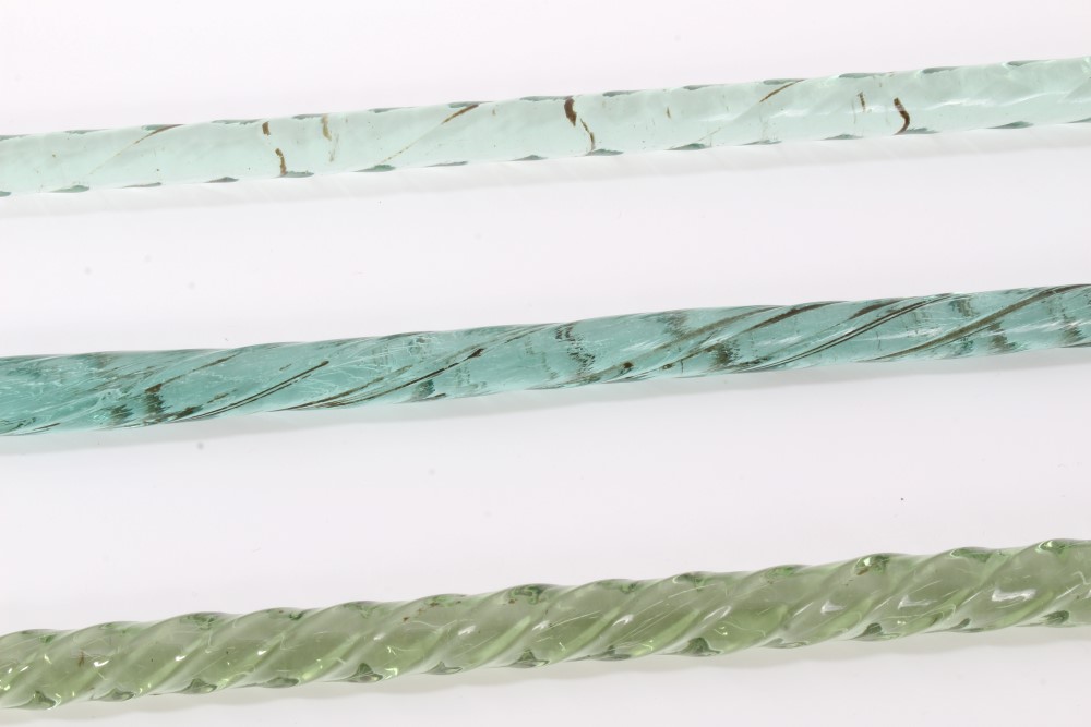 Two late 19th/early 20th century twisted green glass "frigger" walking sticks together with another - Image 3 of 4