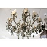 A large cast metal and glass twelve-light chandelier, together with one other smaller with six