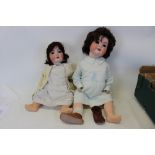 Two German Bisque head dolls together with clothing including Heubach Koppelsdoft with wobbly