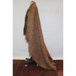 Victorian woven wool Paisley shawl with all-over design in red and green.