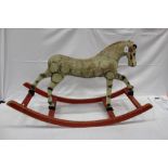 Old carved and painted wood Rocking Horse, straw filled hessian body and clear glass eyes.