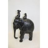Large carved ebony elephant with two riders