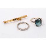 A green stone ring, eternity ring and a gold bar brooch