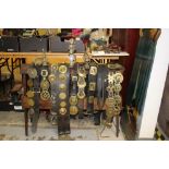 Good display stand of heavy horse martingales, to include 12 leather straps mounted with a fine