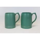 Pair of green Keith Murray Wedgewood tankards, 12cm high