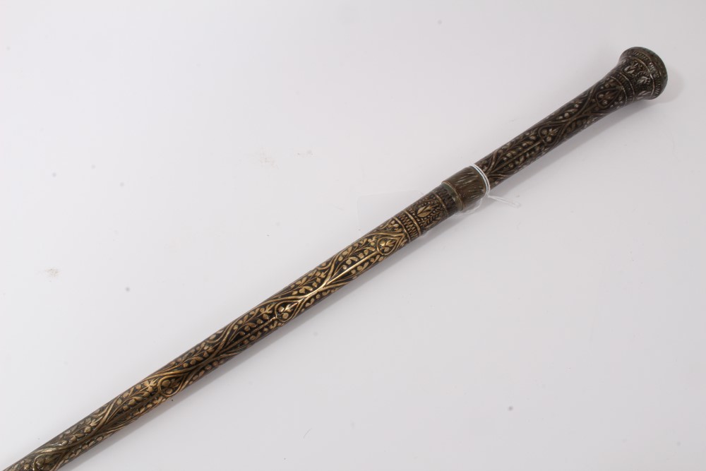 Early 20th century heavy metal walking stick with raised Nielloware style decoration and wiggle