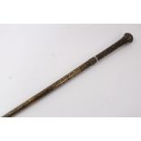 Early 20th century heavy metal walking stick with raised Nielloware style decoration and wiggle