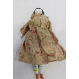 1830 White china doll with moulded hair in original clothing.