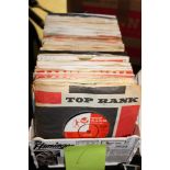 Box of single records including The Fireballs, The Fendermen, Dion and Tim Gentle and his Gentlemen.