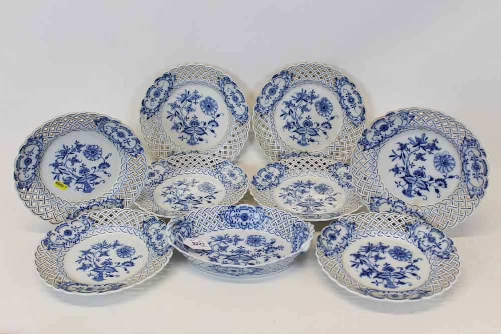 Group of Eight Meissen Onion pattern plates with reticulated borders, together with a similar onion