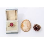 9ct gold garnet cluster ring, 9ct gold and red stone ring and a gold mounted carved cameo brooch