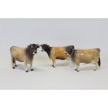 Beswick Cattle comprising Dunsley Cowboy and two other Beswick cattle (3)