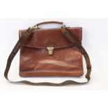 A dark tan leather briefcase by The Bridge