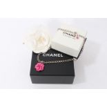 Chanel Camélia pink enamel necklace and Chanel Camélia white fabric brooch