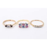 Three gold gem set rings