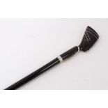 Unusual early 20th century walking stick with ebonised shaft and horn handle carved in the form of