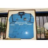 Manchester City signed shirt in frame