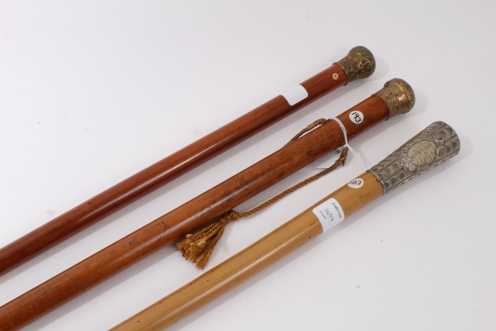 Early 19th century Malacca walking cane with suspension cord and guilt metal top embossed with a