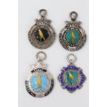 Group of four silver and enamelled canary fancier’s medals