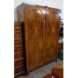 A 4' 20th Century Four Shield Furniture figured walnut wardrobe with hanging space, shelf and mirror