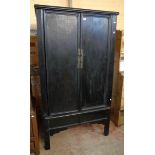 A 3' 8"old oriental black lacquered cabinet with shelf and drawer fitted interior enclosed by a pair