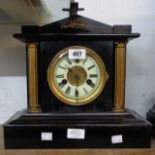 A late Victorian simulated black slate and brass mounted mantel clock with HAC gong striking