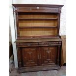 A 4' 3 1/4" Victorian stained oak two part cabinet with now open shelves to top (glazed doors