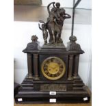 A late 19th Century French ornate black slate and spelter mounted mantel clock of architectural