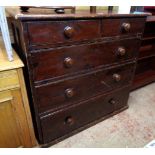 A 3' 4" Victorian stained pine chest with two short and three long graduated drawers, set on