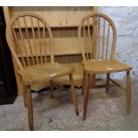 A pair of 1940's Ercol utility furniture model 4a hoop stick back kitchen chairs with original