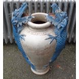 A 31" decorative painted terracotta garden pot with flanking applied dragon decoration