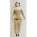 An antique doll with painted porcelain head and lower limbs and stuffed body - hairline crack to