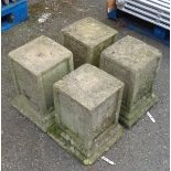 A set of four 14 1/4" cast concrete garden pedestals