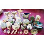 A box containing a collection of miniature ceramics including floral encrusted swan shaped salts,