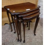 A nest of three reproduction burr walnut tea tables with moulded edges and slender cabriole legs