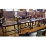 A set of six polished oak framed panel back dining chairs with studded brown leather upholstery, set