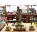 A 19th Century French green onyx and spelter mounted ornate clock garniture with large figure