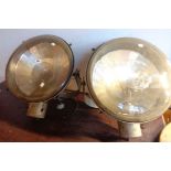 A pair of 1940's G.E.C. industrial spotlights on adjustable brackets