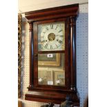 A 19th Century American mahogany cased wall clock by Seth Thomas, with glazed and mirrored panel