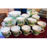 A Victorian part tea service with gilt and floral decoration including cups, saucers, sugar bowl,