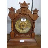 A late 19th Century American stained wood cased shelf clock with Ansonia spring driven gong striking